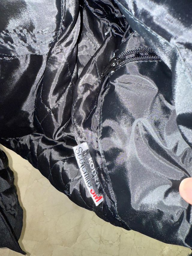 Chaqueta de moto negra y gris