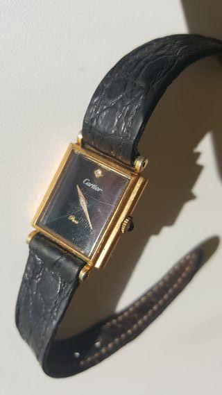 Reloj Cartier Tank Must Negro y Dorado