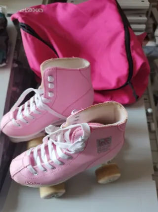 Patines rosas bota + bolsa Oxelo.
