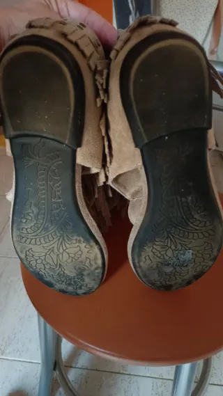 Sandalias altas con flecos
