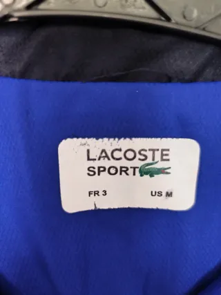 Chaqueta deportiva Lacoste azul y negra Talla M.