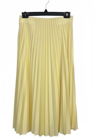Falda plisada amarilla