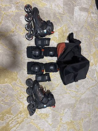 Patines negros y naranjas con bolsa talla 35-38