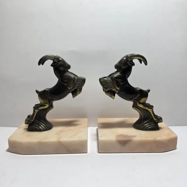 Reggi libri Art Déco con arieti in metallo e marmo