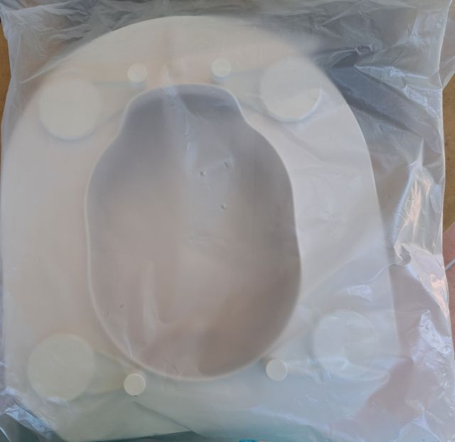 Asiento elevador para inodoro