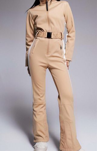 Mono de esquí beige con detalles blancos