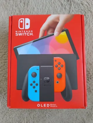 Nintendo Switch OLED blu e rossa impeccabile