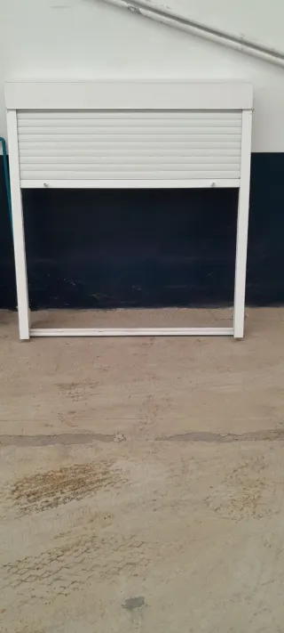 Ventana de aluminio y Reja de acero 