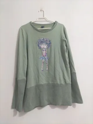 Jersey verde con dibujo de niña