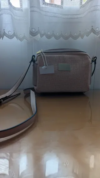 Bolso rosa tipo bandolera