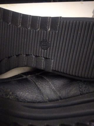 Bluzi Nere in pelle con fibia