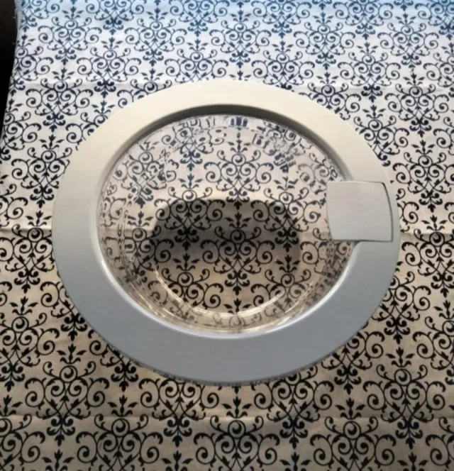 Puerta,bisagra y tapón de desagüe lavadora.