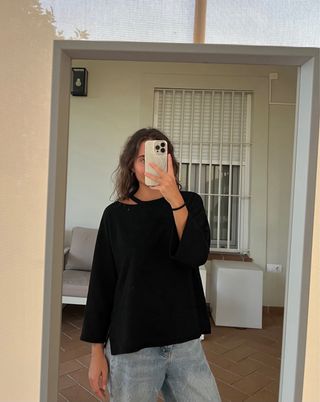Jersey Zara negro con escote asimétrico