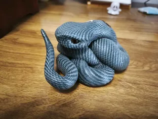 Vela con forma de serpiente
