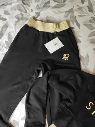 Conjunto SikSilk mujer negro y dorado
