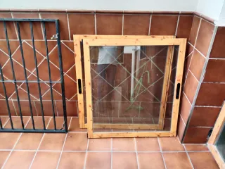 Ventana aluminio con reja de hierro