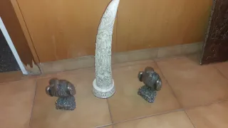 Figuras águilas y cuerno grabado