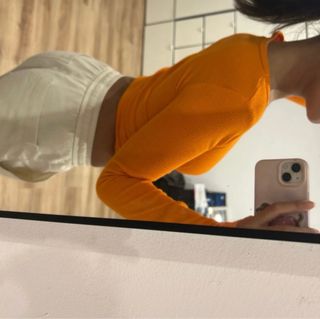 Top naranja fluorescente manga larga