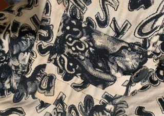 Abrigo desigual botones fantasía