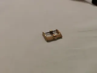 Fibbia Omega Oro