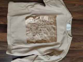 Sudadera niña beige con estampado dorado talla 8/9