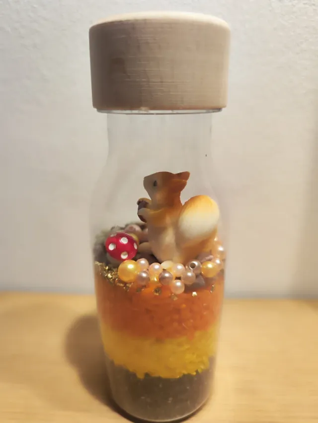 Botella sensorial Ardilla Dorada