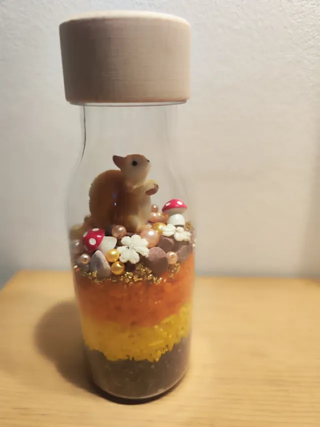 Botella sensorial Ardilla Dorada