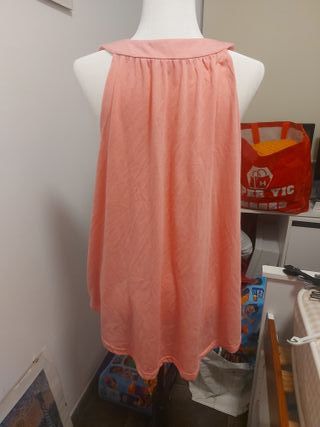 Camiseta rosa con botones