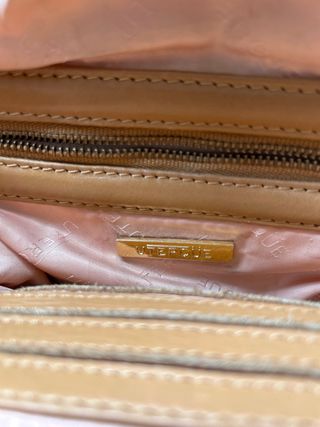 Bolso redondo Uterqüe piel marrón flecos