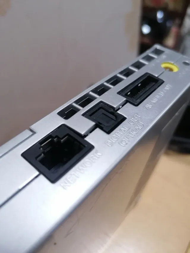 PlayStation 2 PS2 plateada con pack de juegos