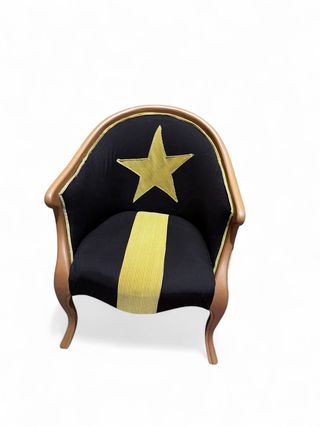 Butaca restaurada con estrella dorada