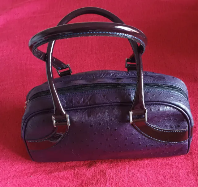 Bolso de piel morado