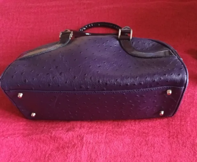 Bolso de piel morado