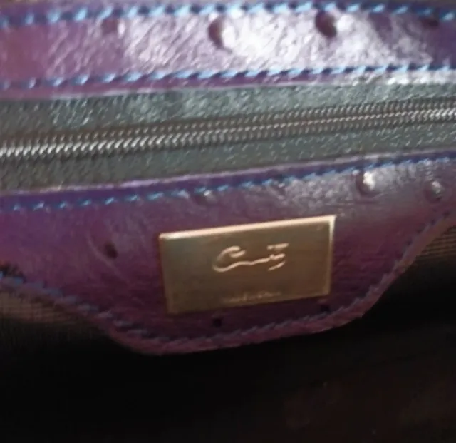 Bolso de piel morado