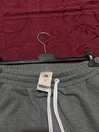 Pantaloni Adidas grigi con zip