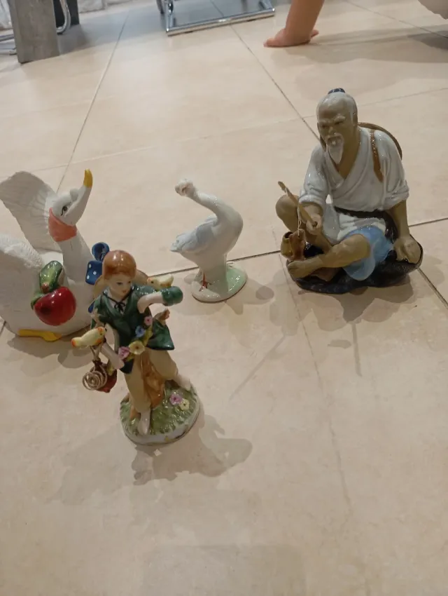 Conjunto figuras porcelana cisnes y pescador