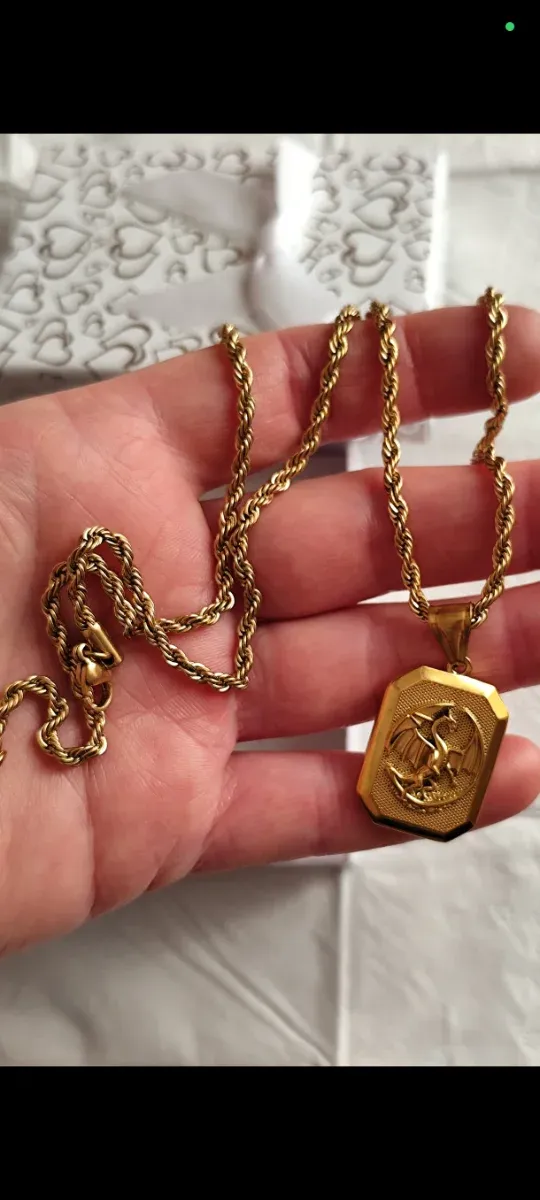 Collana con ciondolo a forma di drago in oro liminada 18 kt