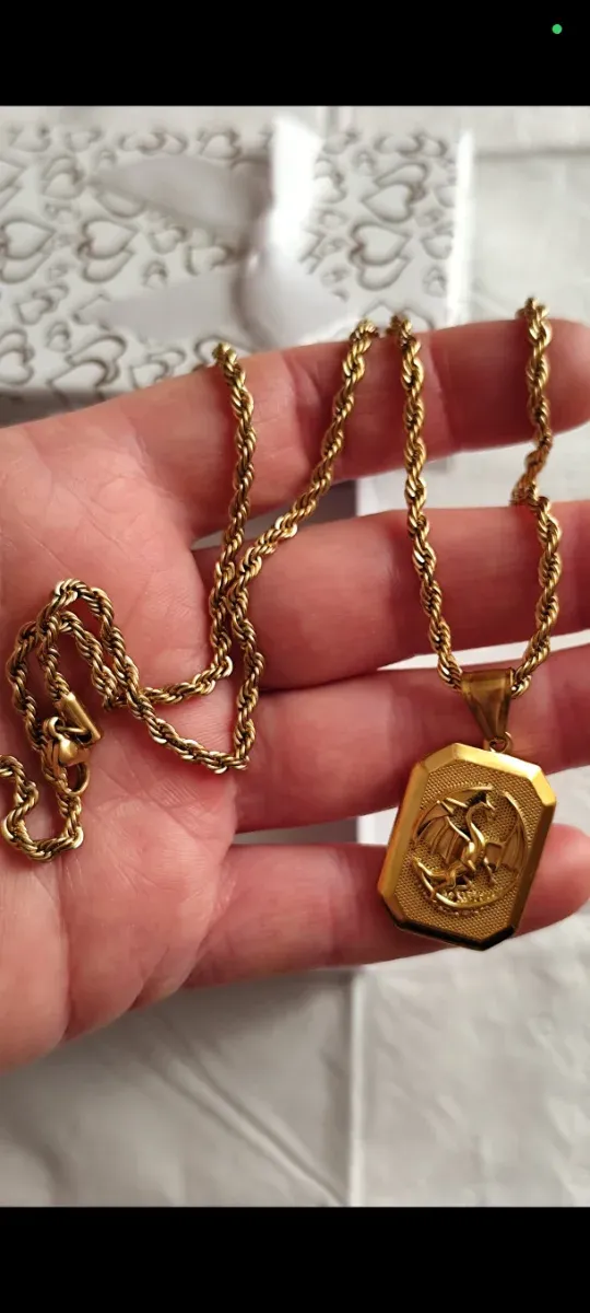 Collana con ciondolo a forma di drago in oro liminada 18 kt