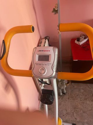 Bicicleta Estática Naranja y Blanca