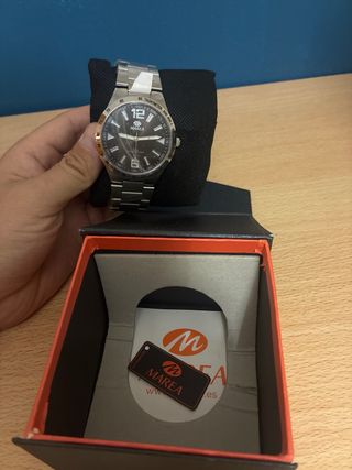 Reloj Marea Negro y Plateado