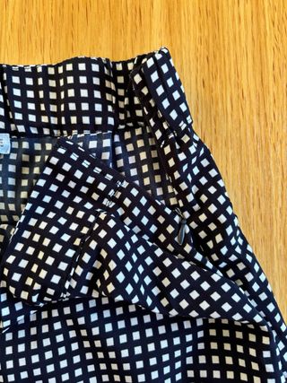 Pantaloni palazzo a quadretti bianchi e neri