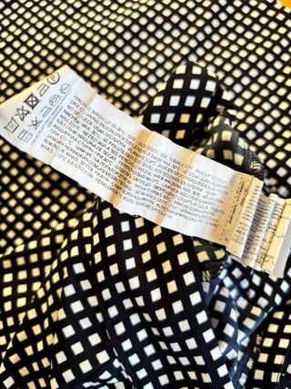 Pantaloni palazzo a quadretti bianchi e neri