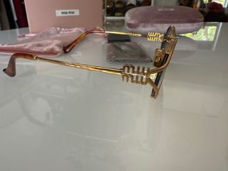 Gafas de sol Miu Miu doradas y marrones