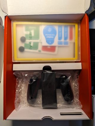 Nintendo Switch OLED + SD 512GB + Pellicole +Gioco