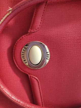 Borsa Moschino fucsia usata
Rovinati i manici foto