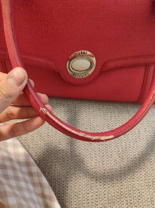 Borsa Moschino fucsia usata
Rovinati i manici foto