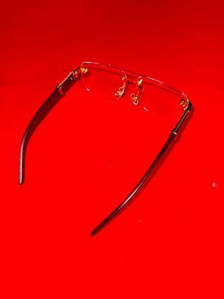 Occhiali firmati marroni e dorati