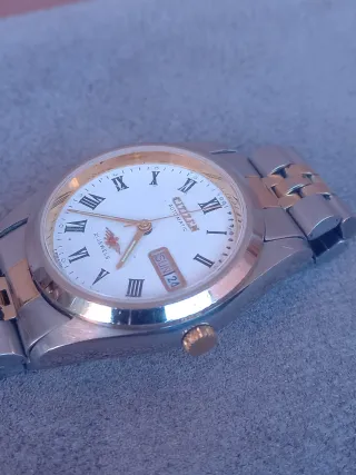 Reloj Citizen Automático Oro y Plata