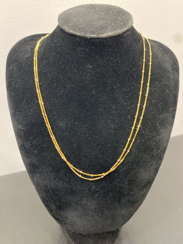 Cadena oro 18k doble con detalles oro blanco