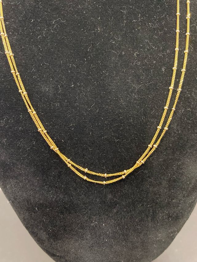 Cadena oro 18k doble con detalles oro blanco